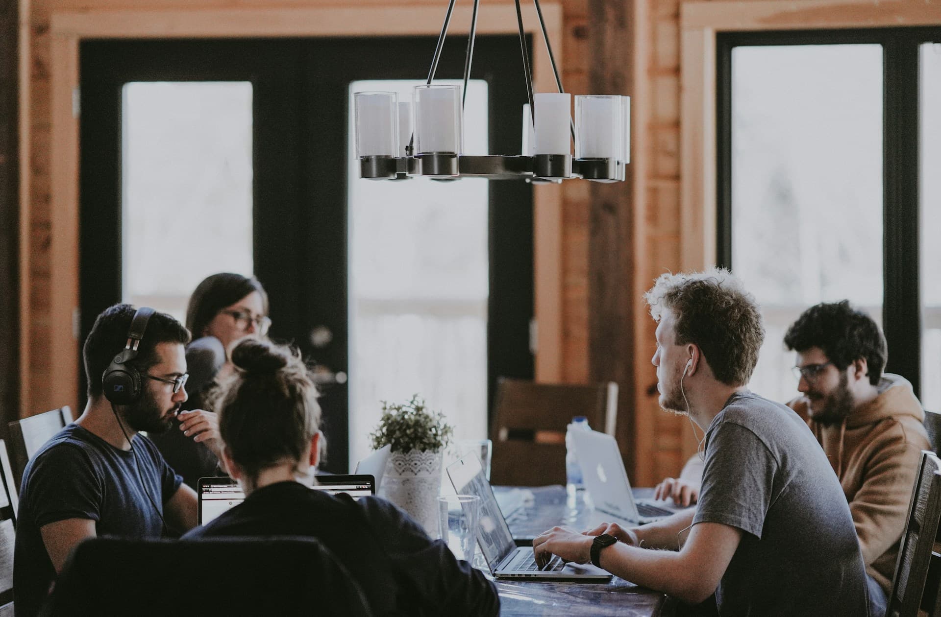 Marketing team collaborating on computers in modern office